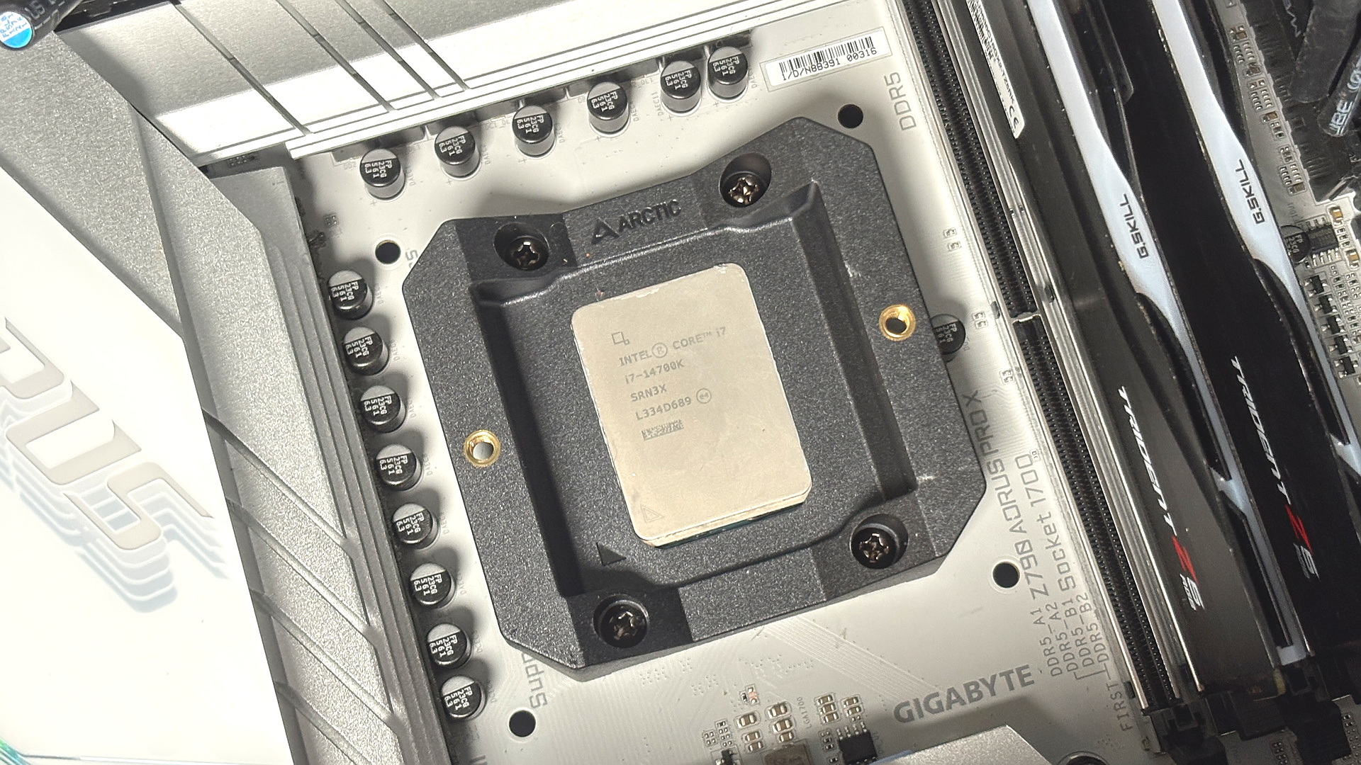 An Arctic Freezer 36-S on a desk and installed in a gaming PC, with the Freezer 36 nearby.