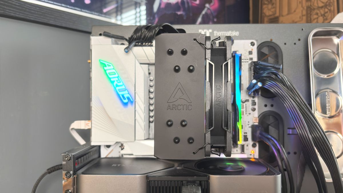 An Arctic Freezer 36-S on a desk and installed in a gaming PC, with the Freezer 36 nearby.
