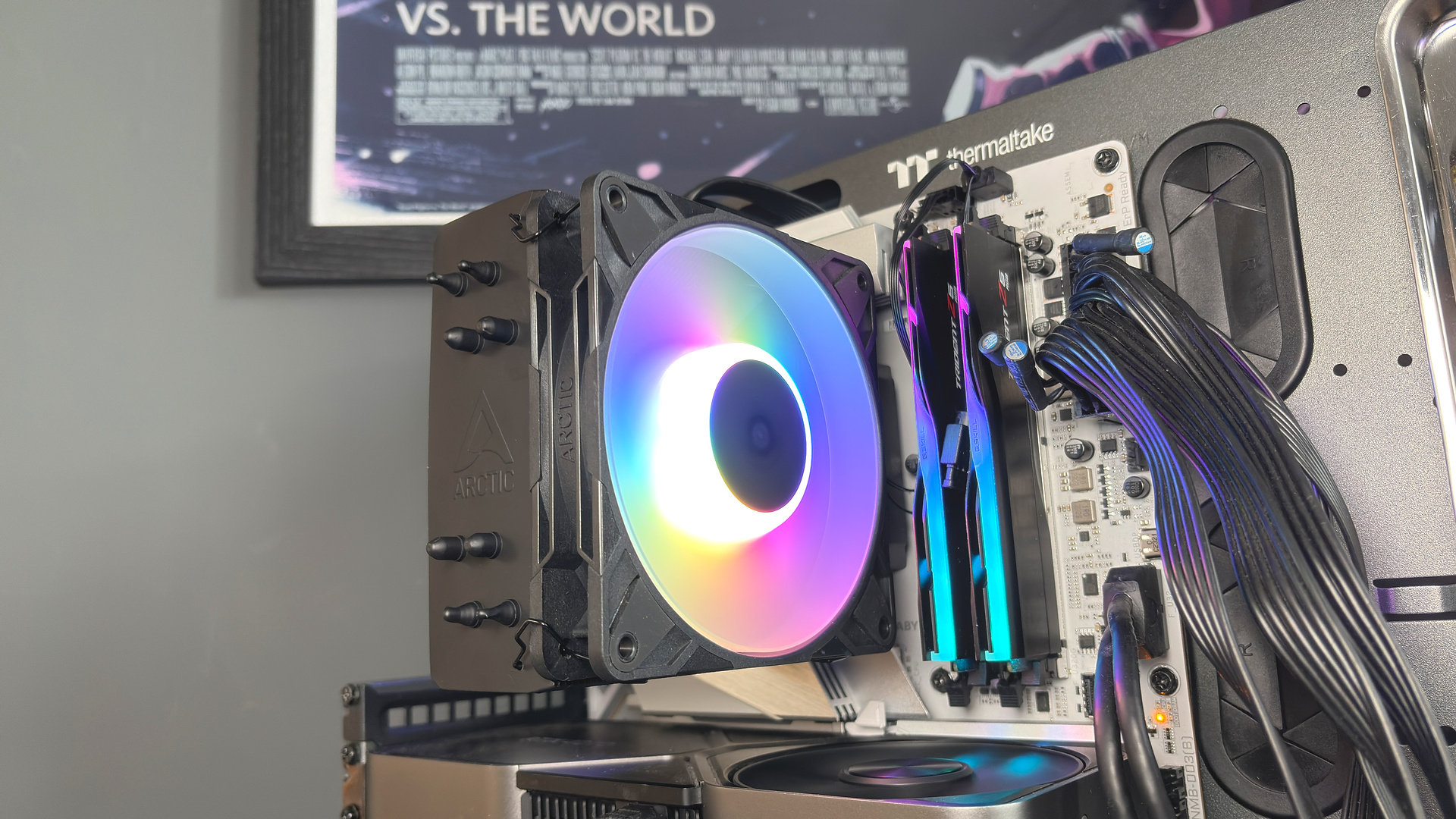 An Arctic Freezer 36-S on a desk and installed in a gaming PC, with the Freezer 36 nearby.