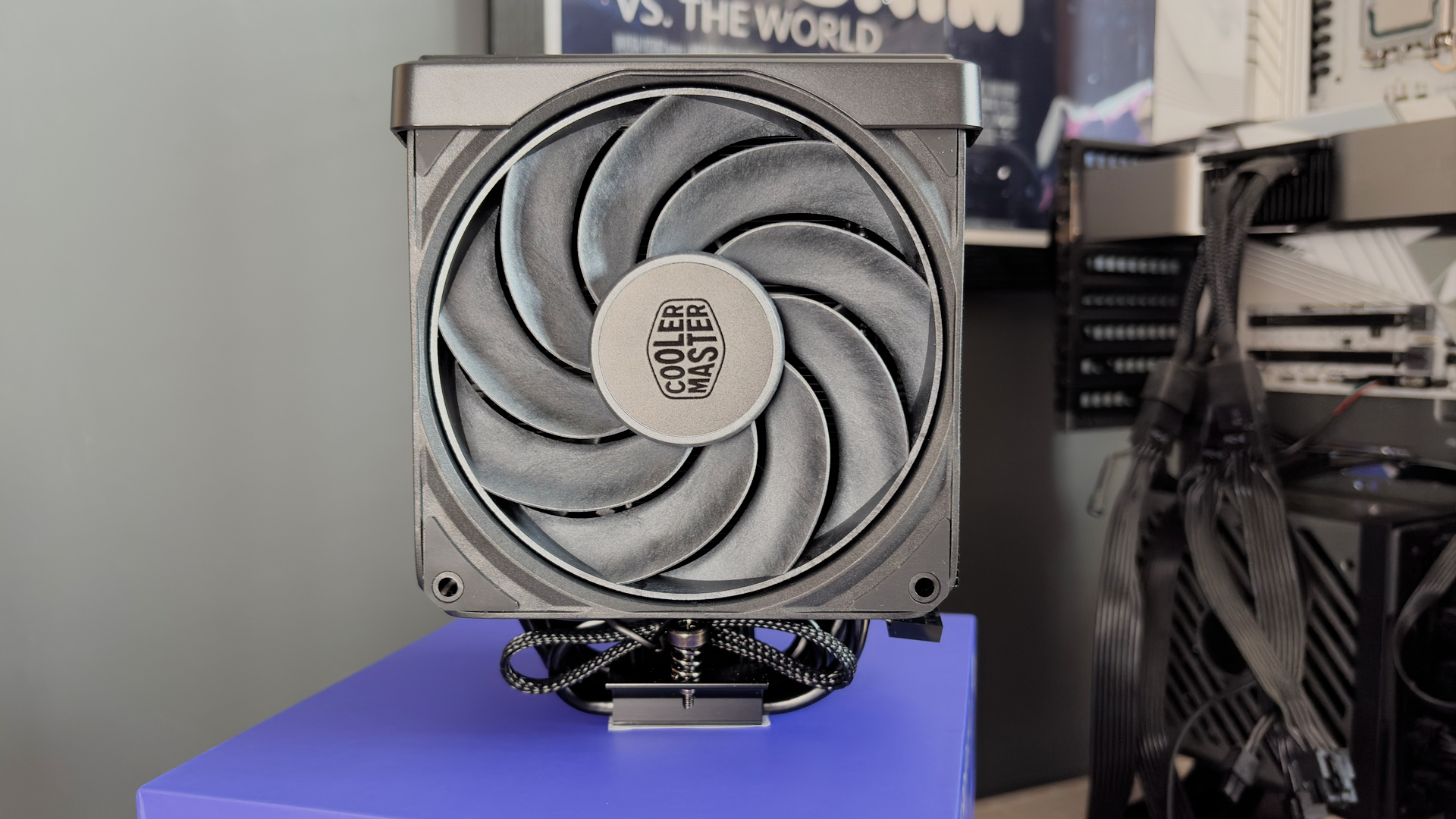 The Cooler Master V8 Ace 3DHP installed on a test bench and on its box.
