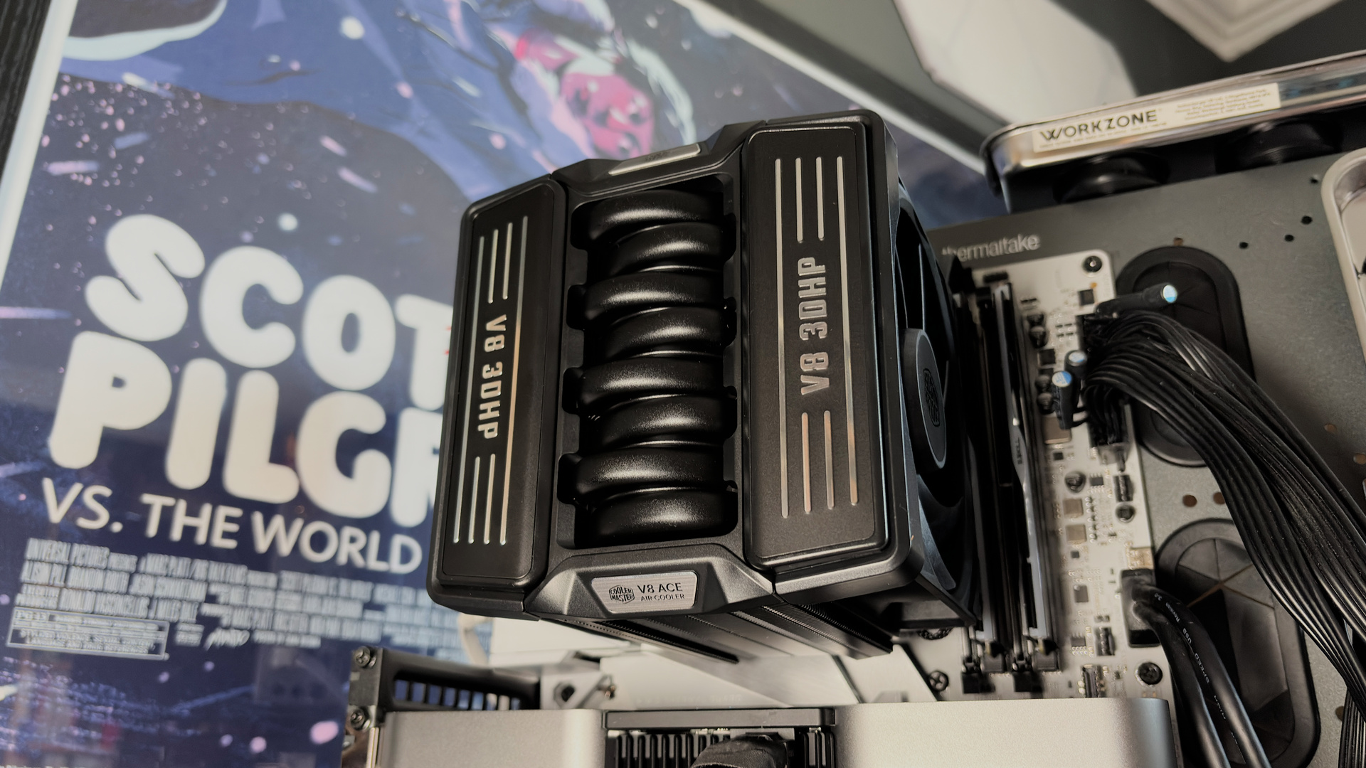 The Cooler Master V8 Ace 3DHP installed on a test bench and on its box.